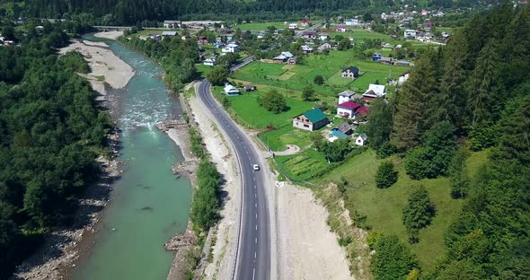 Beautiful Aerial view of summer road. Captured from above with a drone. Ukrainian Carpathians
