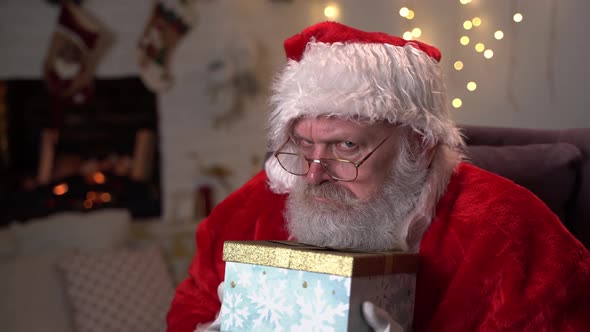 Greedy Santa Claus Is Holding a Box of Christmas Gifts, Choosing New Year's Gifts, Santa Claus