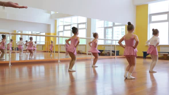 Group of little girls practicing in ballet school