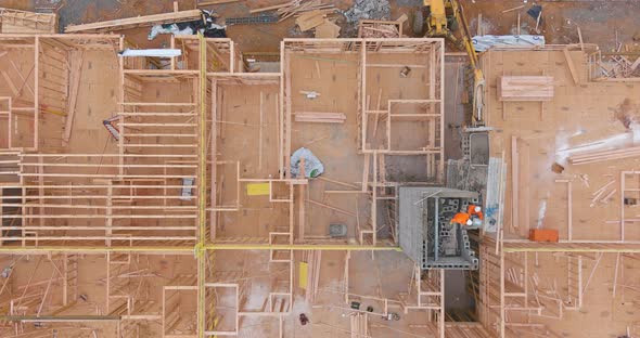 Aerial view of elevator shaft for concrete block building under construction work alt