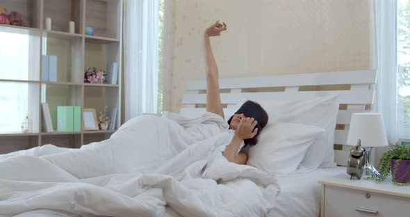 Asian young woman wake up late with alarm clock alt