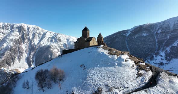 Aerial view of Gergeti Trinity Church, Tsminda Sameba in Kazbegi. Georgia 2022 alt