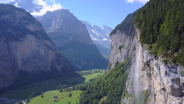 Aerial travel drone view of the Lauterbrunnen Valley and Staubbach Falls, Switzerland. alt