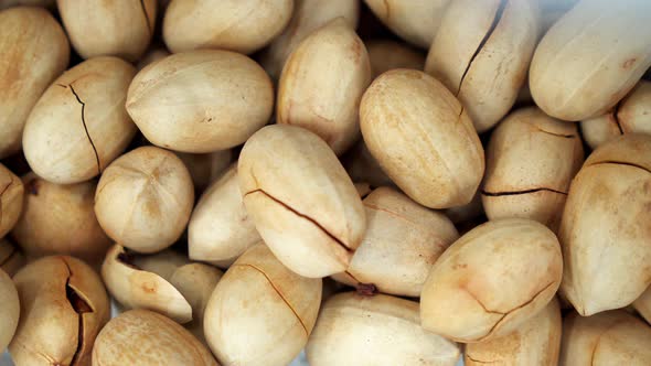 A Lot of Mixted of Nuts Close Up Spinning on the Background in a  Store alt