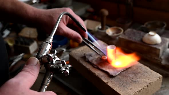Closeup of Wedding Ring Polishing By Caicasian Jeweler Isolated  Footage alt