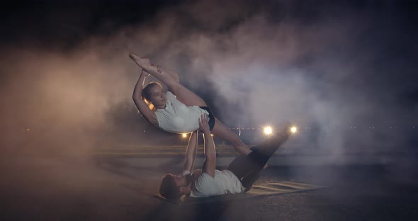 Male and Female Gymnasts Are Performing Outdoors Smoke in the ...