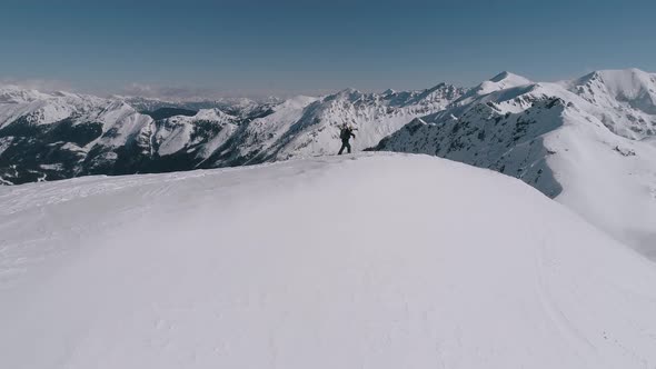 Skier Hiking On Top Of The Mountain Winter Aerial