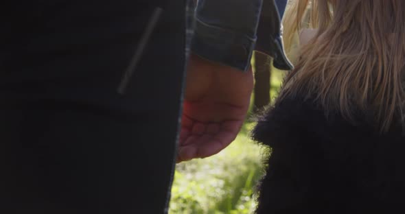 Dad And Baby In Motion Holding Hands alt