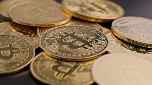 Bitcoin Coins on Black Background  Closeup Fullframe Spinning Background