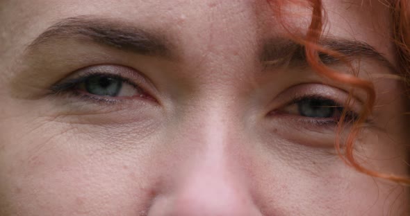 Close Up of Blue Eyed Young Ginger Attractive Girl Who Is Looking at Camera and Smiling alt