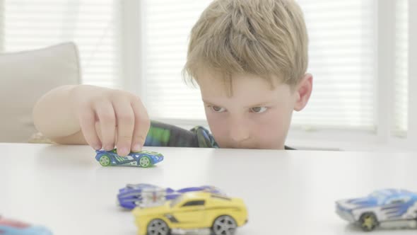 Boy playing with toy cars