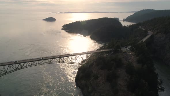 Aerial Of Cars On Weekend Vacation Traveling Across High Ocean Bridge Between Islands alt