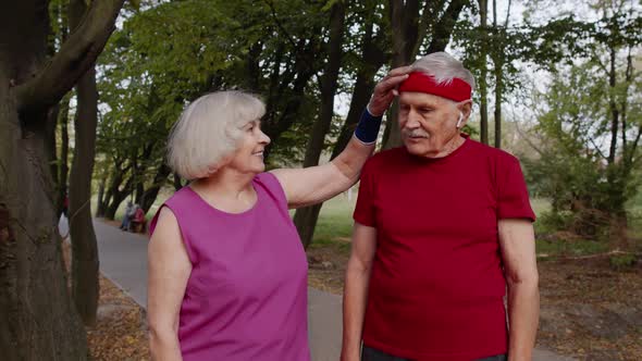 Mature Family Couple Together After Running Using Smart Watch, Tracking Result of Fitness Workout alt