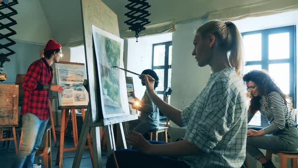 Painting Lesson Held By a Male Teacher in the Studio alt