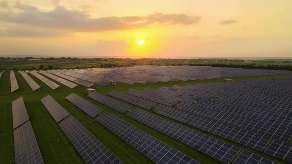 Aerial View of Large Sustainable Electrical Power Plant with Rows of Solar Photovoltaic Panels for alt