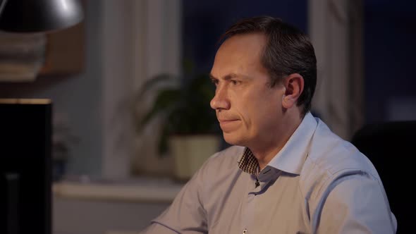 Design Engineer Works on His Personal Computer. Businessman Working Alone. Graphic Designer alt