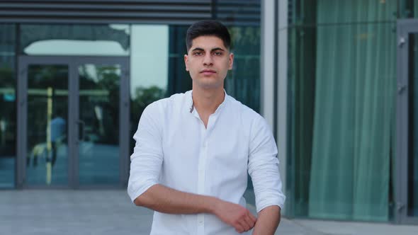 Closeup Headshot Confident Serious Concentrated Indian Arabic Young Man Wearing Shirt Stand Posing alt