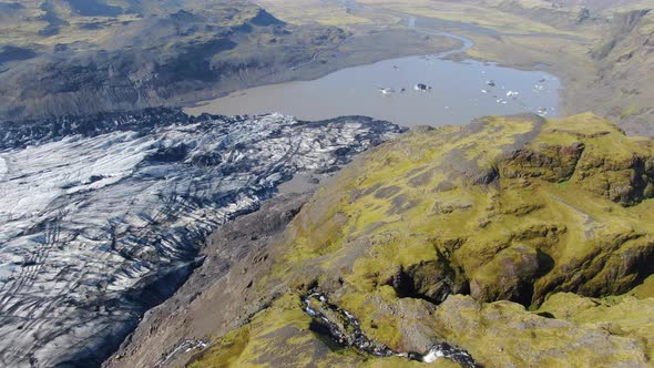 Drone approaching a waterfall at Solheimajokull glacier in Iceland ...