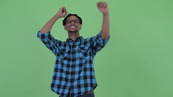 Happy Young African Hipster Man Getting Good News alt