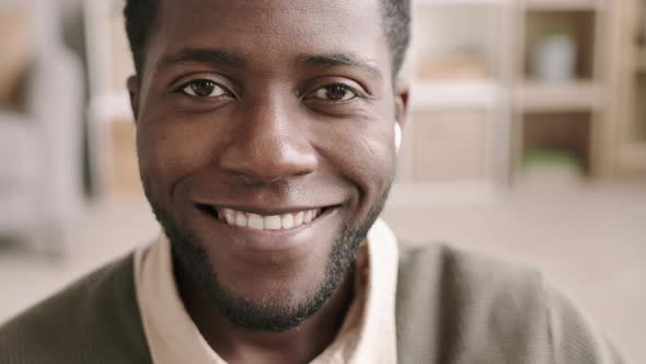 Portrait of Smiling African Man alt