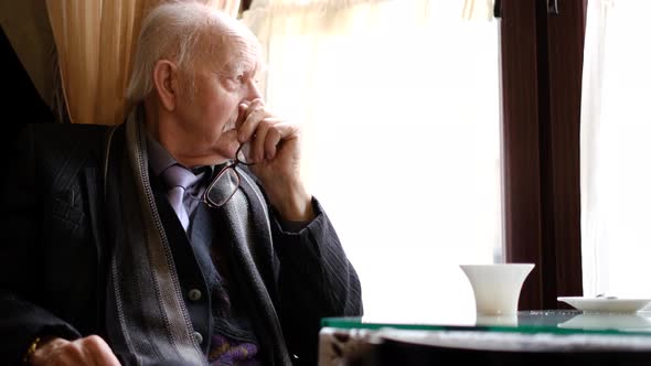 The Old Bald Man Has a Headache He is in Despair and Depression alt