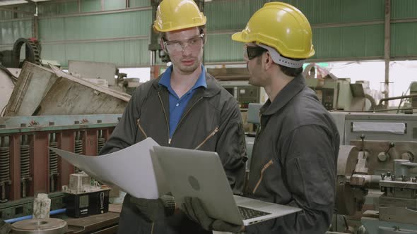 Two engineer man and partner work with laptop computer and having agreement for success. alt