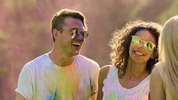 Two Dancing Couples Covered in Colored Powder, Happy Friends Enjoying Party alt