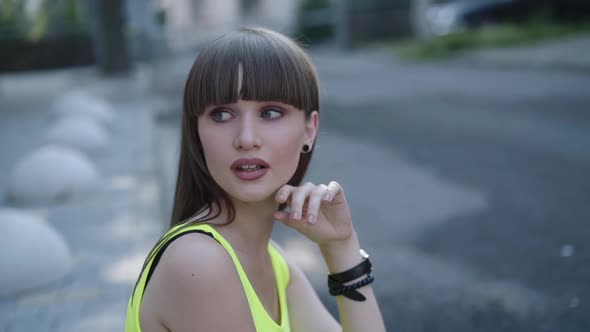 Beautiful Look of Charming Girl with Long Hair Smiling on a Street alt
