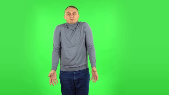 Displeased Man Indignantly Talking To Someone, Looking at the Camera. Green Screen alt