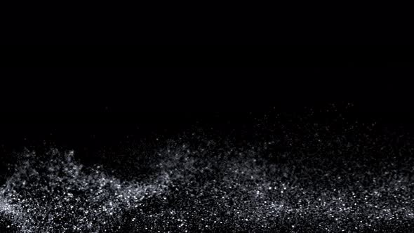 Super Slow Motion Shot of Silver Glitter Wavy Background Isolated On Black at 1000 Fps alt