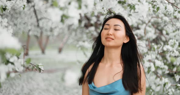 Woman in Blooming Apple Trees alt