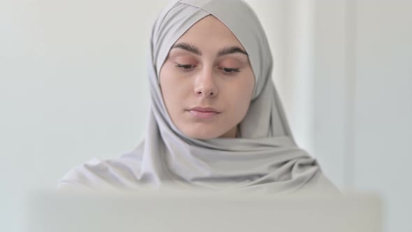 Arab Woman Working on Laptop alt