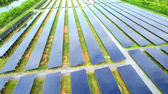 Drone fly over solar farm, renewable energy from solar. alt