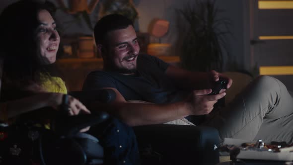 Man Playing Video Game Near Woman in Wheelchair alt
