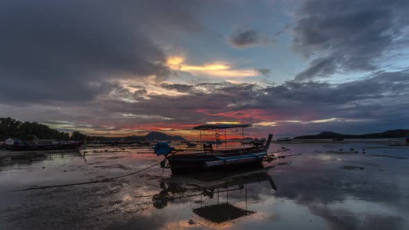 Time Lapse Cloudy Above Fishing Boat In Sunrise alt