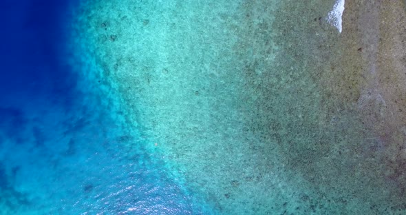 Beautiful fly over abstract view of a paradise sunny white sand beach and blue water background  alt