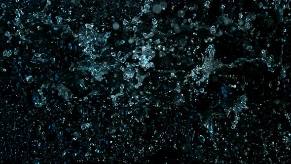 Super Slow Motion Abstract Shot of Splashing Blue Neon Water at 1000Fps alt