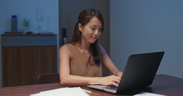 Woman feel annoy of using laptop computer at home in the evening alt