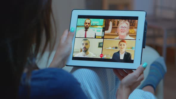 Woman Listening Online Training on Tablet alt