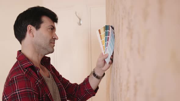 Adult Male picking colours for home interior