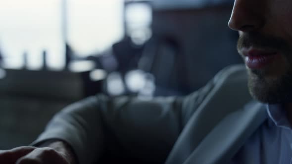 Serious Man Looking Mobile Phone in Private House Portrait alt