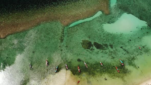 Fishing Boats Near Reef. Beautiful Aerial View of Fishing Boats Floating on Blue Sea Water Near alt