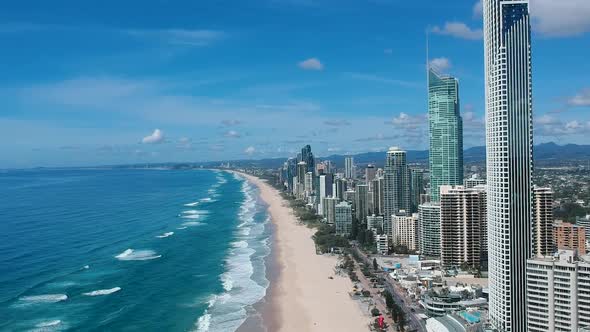 High aerial view video capturing the landmark high-rise buildings along the beach front of the Surfe alt