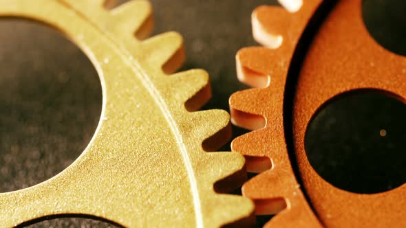 clock wheels turning,touching each other - close up alt