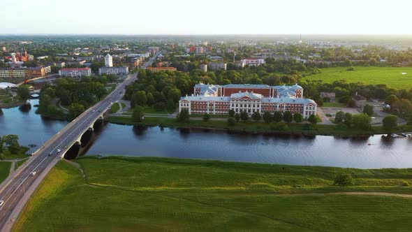 Aerial View of Jelgava City Panorama and Lielupe River in Latvia, Zemgale at Sunset 4K Dron Shot alt