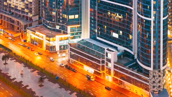 Hyperlapse Street Night Yellow Illumination Reflected in Skyscrapers Windows alt