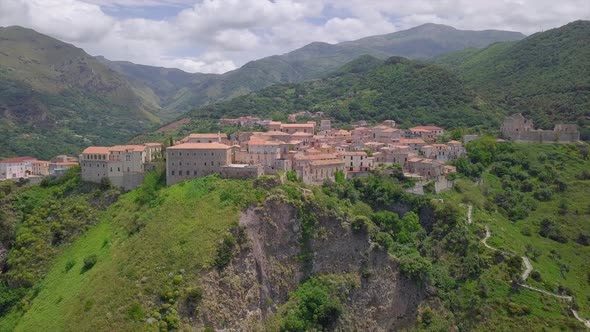 Aerial Medieval Village on Cliff Overlooking Mountain Gorge, Old Town Buildings with Red Tile Roofs alt
