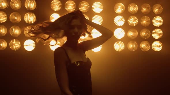 Beautiful Woman Dancing Sexually Alone in Night Club Spotlights alt
