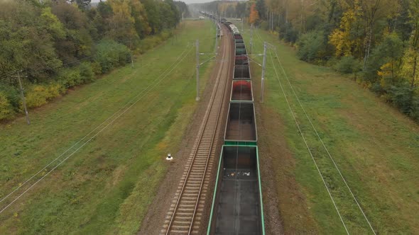 Train with Empty Gondola Cars in Rural Areas alt