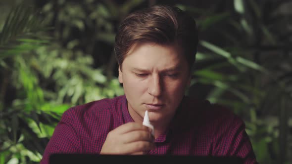 Attractive Man Using a Cold Spray alt